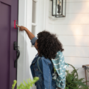 Child using a Smart Lock by Yale to get into her home