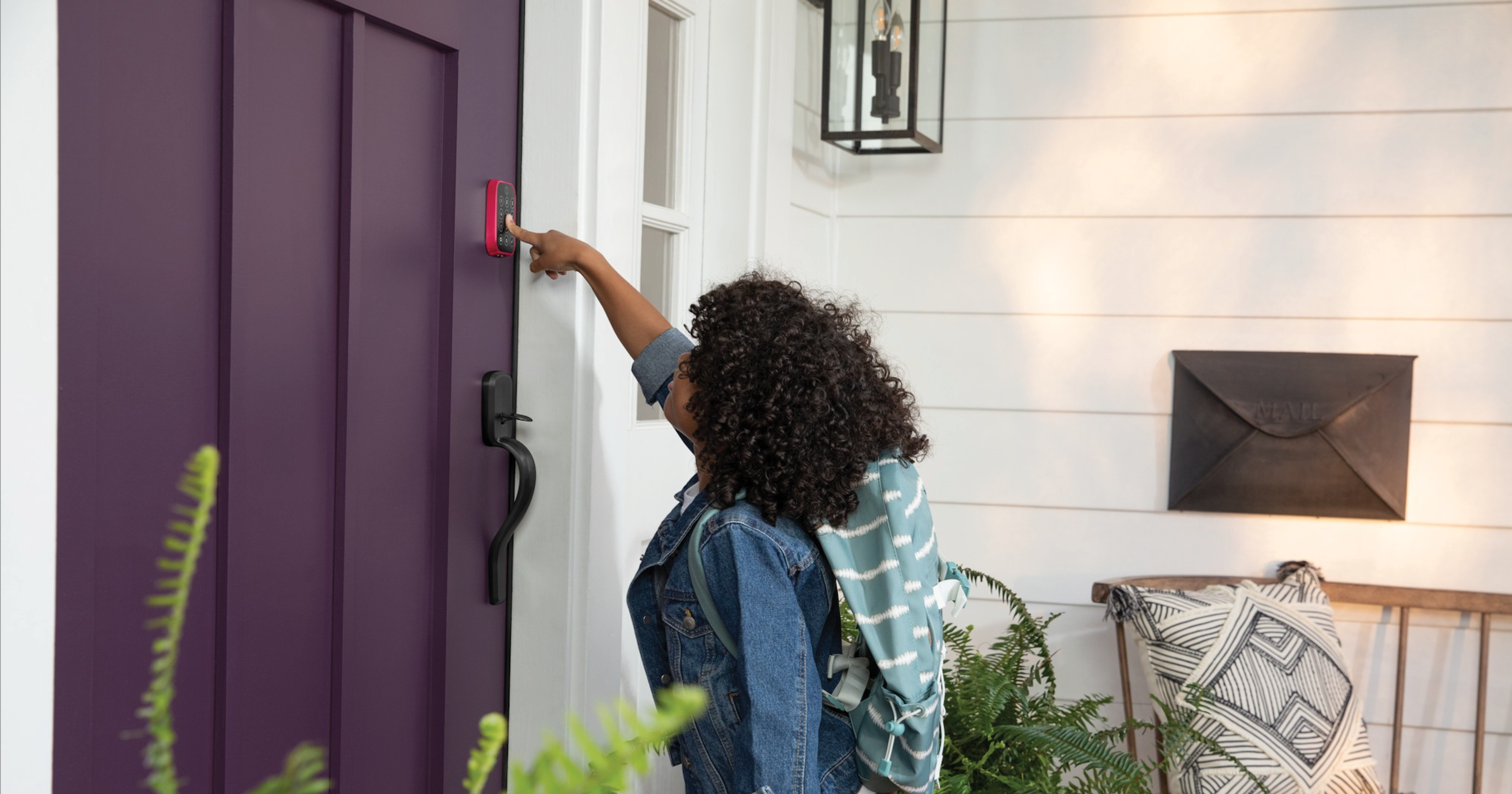 Child using a Smart Lock by Yale to get into her home